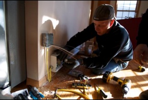 In New York, an electrician installs a heat register as part of the FEMA Sheltering and Temporary Essential Power (STEP) Program to help people get back into their homes quickly and safely.