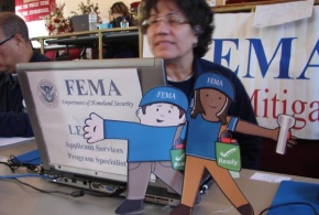 Flat Stanley and Flat Stella visit a FEMA Disaster Recovery Center specialist who is discussing mitigation best practices with Hurricane Sandy survivors.