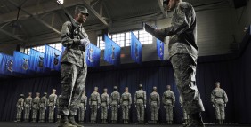 U.S. Air Force Airman Jason Ortega, left, holds his M14 rifle while Staff Sgt. Robert Barnhart, an instructor, writes notes during an evaluation at the U.S. Air Force Honor Guard at Joint Base Anacostia-Bolling, Washington, D.C