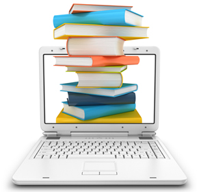 A laptop with books in the center of the screen; iStock.com