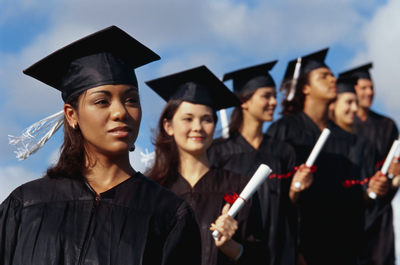 A group of graduating students against a blue sky; ThinkStock.com