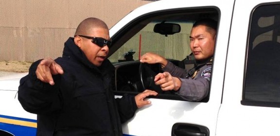 Sgt. Reggie Kim (right) and Officer Rhodes Johnson (left) consult about Pentagon perimeter security during the Fifty-Seventh Presidential Inauguration.