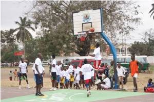 NBA and WNBA stars - Bo Outlaw and Edna Campbell - with local players (State Dept.)
