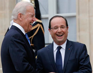 U.S. Vice President Joe Biden, left, j okes with French President Francois Hollande as he leaves the Elysee Palace after their talks, in Paris, Monday, Feb. 4, 2013. (AP Photo/Christophe Ena) 

