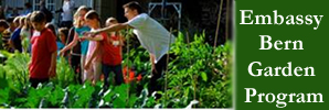 picture of children in green garden with Embassy Chef David Lindsay.