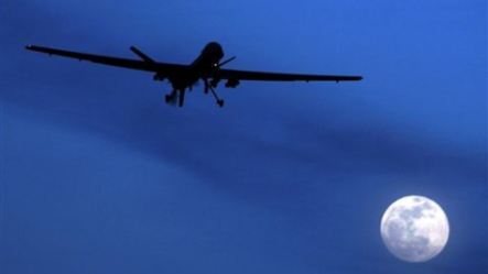 A U.S. Predator drone flies over the moon above Kandahar Air Field, southern Afghanistan (File Photo)