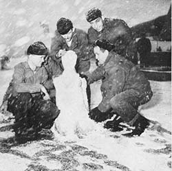 USS Wisconsin sailors making snowman, while off the coast of North Korea, 1952
