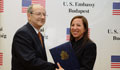 Ambassador Kounalakis presents the Active Citizenship Award to Dr. Somogyi, principal of the Berzsenyi High School (Embassy photo by Attila Németh)