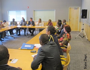 Group sitting around table. (Dept. of State)