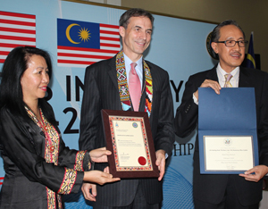 Ambassador Jones and Datuk Masidi with the exchanged certificates.  Looking on is Joanna Kitingan, Director of Sabah Museum. (U.S. Embassy photo)