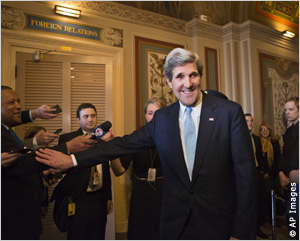 John Kerry smiles after receiving unanimous approval from the Senate Foreign Relations Committee January 29 to become secretary of state.