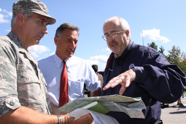 Administrator Craig Fugate (right) goes over a map of Ludlow with Vermont Governor Peter Shumlin (center) and General Dick Harris, Brigadier General, Vermont National Guard.