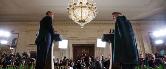 President Obama and President Karzai at podiums making a speech