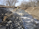 The left bank of Deep Creek has eroded dangerously close to I-70 in two locations. Located in Riley County, Kan., this project is one of four Section 14, Emergency Stream Bank Stabilization Projects underway in the Kansas City District. A combination of willow stakes and stone protection is being used. As the willow stakes mature, their roots, along with the stone, will help stabilize the channel. 