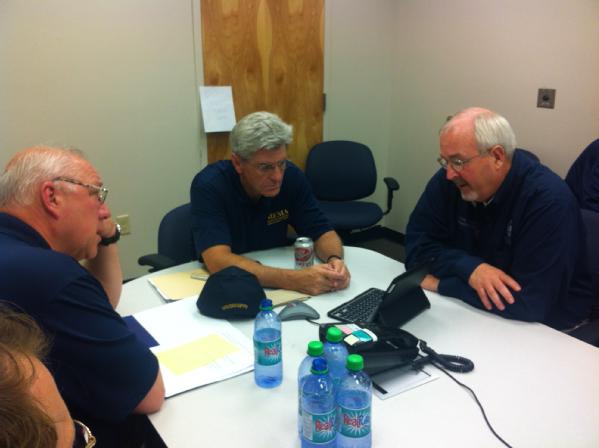 Gulfport, Miss., Aug. 28, 2012 -- FEMA Administrator Craig Fugate meeting with MEMA Director Robert Latham (left) and Mississippi Gov. Bryant (center) to discuss Hurricane Isaac preparations.