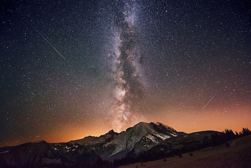 Some images are just plain extraordinary &#8212; and often, the photographer has invested a great deal of time and effort to make that image happen. Photographer Dave Morrow describes the process of making this image from Mount Rainier National Park in early October 2012:&#8220;I went up to Sunrise Point at Mt. Rainier last weekend with my buddy Keith. After a lame sunset, we waited for the Milky Way to come out. The placement was just perfect &amp; the sky was pitch black! Time to jack up the ISO and shoot some stars… This was one of many from the night:)&#8221;Visit Rainier on a beautiful day, and you&#8217;ll get a great photograph. Stick around for the sunset, and you&#8217;ll often get an exceptional photograph. Wait till the chill of October sets in on a clear night, and stand around fiddling with your camera for a few hours in the dark&#8230; and the results just might be extraordinary.Photo by Dave Morrow - www.DaveMorrowPhotography.com