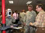 Jack Peters, Metal Working and Services Division chief, U.S. Army Ordnance School, right, explains to Lt. Gen. David D. Halverson, Training and Doctrine Command deputy commanding general and chief of staff, how the department's virtual welder system teaches the fundamentals of welding Sept. 11. Maj. Gen. Larry D. Wyche, Combined Arms Support Command and Sustainment Center of Excellence commanding general, hosted Halverson during a familiarization and orientation visit.