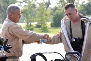 Sgt. 1st Class Todd Keith (left) helps Staff Sgt. Keith Mess (both of the 44th Civil Support Team) remove a protective chemical suit and cool down during a weapons of mass destruction exercise in St. Augustine, Fla., June 11, 2009. With temperatures at the exercise site topping 100 degrees, the Soldiers in the airtight chemical suits combatted overheating and dehydration throughout the day. Photo by Tech. Sgt. Thomas Kielbasa