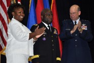 Newly promoted Brig. Gen. Michael Calhoun (center) receives congratulations from his wife Sophia and the Adjutant General of Florida Maj. Gen. Emmett Titshaw (right) during a military promotion ceremony at the Calaway Armory in West Palm Beach, Fla., this afternoon. Brig. Gen. Calhoun is the commander of the 83rd Troop Command and has served in the Florida National Guard for more than 30 years. Photo by Master Sgt. Thomas Kielbasa