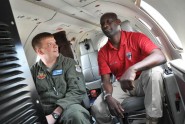 Maj. David Brown from the Florida Air National Guard's 125th Fighter Wing (left) discusses the equipment on his unit's RC-26 airplane with Earl Bowen from the Regional Security System (RSS) during a state partnership exchange in Jacksonville, March 14, 2012. The three-day informational exchange was part of Floridaâs ongoing State Partnership with the RSS, and centered around repairs, upgrades and training on the RC-26 fixed wing aircraft. Photo by Master Sgt. Thomas Kielbasa