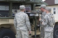 Soldiers from Company C, 146th Expeditionary Signal Battalion, train on the Satellite Terminal Trailer (STT) during annual training at Camp Blanding Joint Training Center.