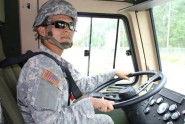 Spc. Cesar Rivas scans the road before pulling off for his road test during driver's training with the 164th Air Defense Artillery Brigade. The road test checks the Soldier's ability to control the vehicle during different situations, while also getting the Soldier comfortable driving. Photo by Sgt. Valeria De Jesus