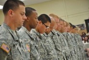 Soldiers from the Florida Army National Guard's 3rd Battalion, 265th Air Defense Artillery Regiment, bow their heads during a benediction at the unit's deployment ceremony in Sarasota, Fla., July 14, 2012. More than 200 Soldiers from the unit were deploying for a year to provide air defense support in the National Capital Region. Photo by Master Sgt. Thomas Kielbasa