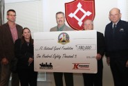 Maj. Gen. Emmett R. Titshaw, the Adjutant General of Florida (far right) stands with members of the Florida National Guard Foundation board and representatives from Kangaroo Express after accepting a donation of $180,000 from Kangaroo Express on behalf of the Florida National Guard Foundation, Nov. 8, 2012.