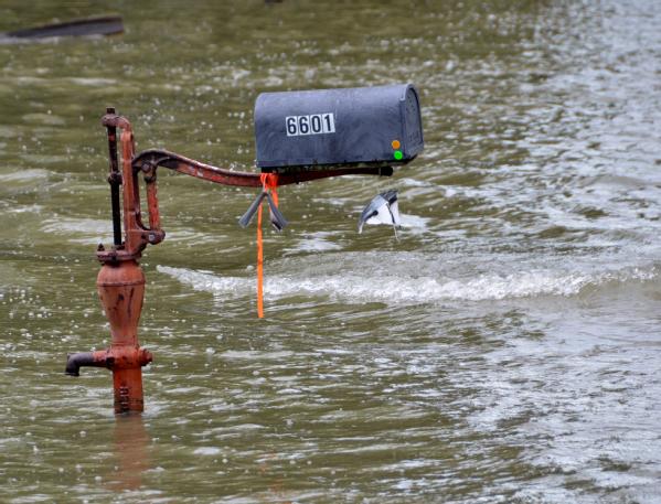 Flood waters reach up a mailbox in a residential area. Heavy spring rain and melting snow pack contributed to historic water levels and flooding in the area.