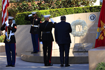 Brig. Gen. Vincent A. Coglianese, left, the base commanding general and regional authority for five military installations in the Southwestern United States, salutes the tomb of former President Ronald W. Reagan during the playing of Taps, accompanied former New York Mayor Rudy Giuliani at the 102nd Anniversary of President Ronald Regan’s Birthday here Feb. 6.