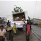 people help distribute supplies from truck