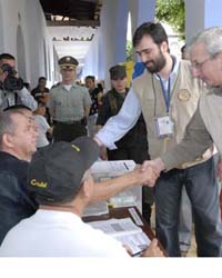 OAS OAS Assistant Secretary for Political Affairs Dante Caputo and Pablo Gutierrez of the Political Affairs Secretariat oversee the OAS electoral observation mission to Colombia's legislative, state, and local elections. (OAS Photo)