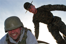 Senior drill instructor Staff Sgt. David Gentry informs a teacher from Recruiting Station Kansas City how to properly maneuver through the bayonet assault course during an educators workshop Jan. 29. For additional imagery from the event, visit www.facebook.com/rstwincities. 