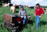 Photo of NRCS employee assisting a Wisconsin grazier.