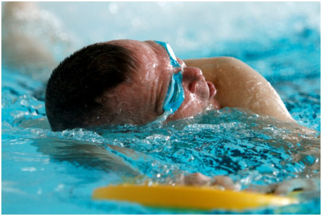 MSG Ron Prothero, who is stationed at Warrior Transition Unit, Fort Sam Houston, Texas, practices swimming laps during the 2013 Team Army Warrior Games cycling and swimming selection clinic. The selection clinic was conducted January 07-12 at Fort Bliss, Texas. (Photo by Patrick Cubel)