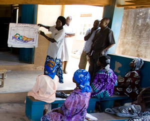 Photo of woman teaching before a class.