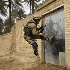 Soldier breaking into a building