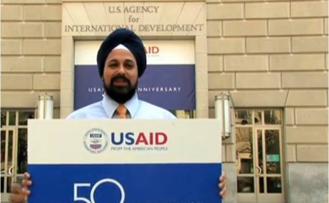 Man holding USAID sign