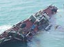 Oil in the Ocean sinking fuel barge still shot