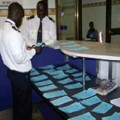 two men with paperwork