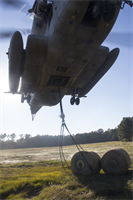 Marines of Combat Logistics Battalion (CLB) 26 practice suspending five ton water bladders beneath a CH-53E with Marine Medium Tiltrotor Squadron (Reinforced) 266 at Camp Lejeune, N.C., 23 Oct., 2012. CLB-26 and VMM-266 (Rein) are reinforcements of 26th MEU, which is slated to deploy in 2013.