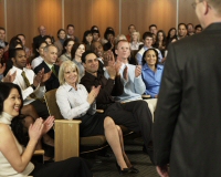 Audience applauding a speaker