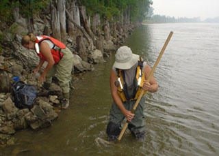 Jim Luzier and Brenda Woodward collecting macroinvertebrate kick net and periphyton samples