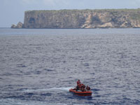 Scientists returning to the ship after a visit to Mona Island