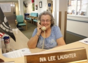 Volunteer Iva Lee @ Reception Desk answering the phone