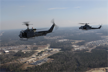 Marine Light Attack Helicopter Squadron 269 Marines bid fair winds and following seas to the UH-1N Huey on its final flight with the squadron across the skies of Marine Corps Air Station New River, Feb. 5. Two UH-1N Hueys were joined by its replacement, a UH-1Y Huey and its partner in the sky, an AH-1W Cobra. After the flight, Col. Scott S. Jensen, Marine Aircraft Group 29 commanding officer, reflected on the history of the UH-1N Huey. 