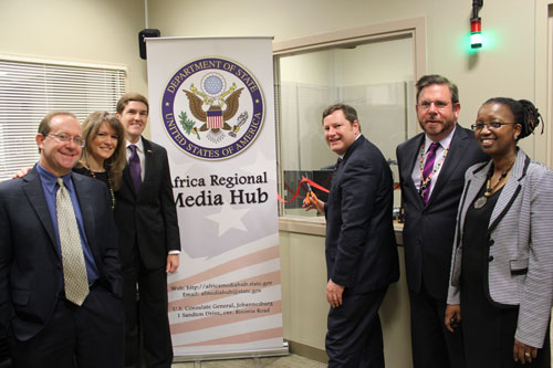 Assistant Secretary of State for Public Affairs Mike Hammer, accompanied by Africa Regional Media Hub and Public Affairs staff, cuts the ribbon to re-launch the Africa Media Hub in its new location in Johannesburg, South Africa