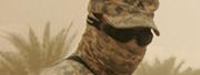 Closeup 
of soldier in goggles and camouflage fabric face covering in the 
desert