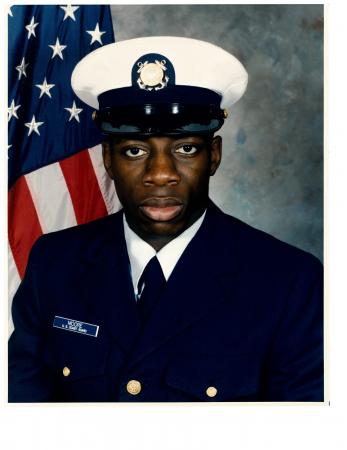 Seaman Recruit Commander K. Moore shown January 1996 in his official photo from Basic Training. U.S. Coast Guard photo.