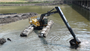 Dover Dam: DOT Big Float and Trackhoe dips silt from the River.